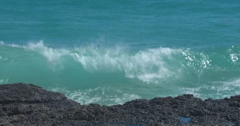 Waves Rolling in Behind Volcanic Rock in Hawaii Stock Footage 104456736