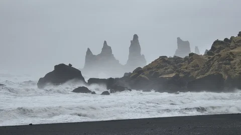 Waves Rolling Onto Black Ash Beach Near Vik, Reynisdrangar Rock Formations Stock Footage 97479408