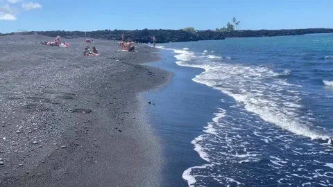Waves Rolling onto Black Sand Beach Видео 196942724