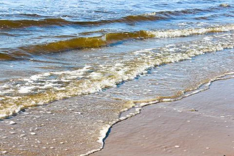 Waves rolling in on the coast Stock Photos