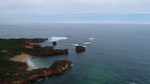 Waves rolling in to coastline by drone great ocean road Stock Footage 84314795
