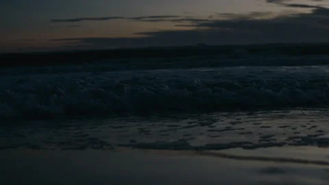 Waves rolling in at dawn to dusk Stock Footage 169243030