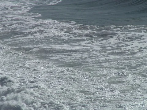 Waves rolling in Stock Footage 93340633