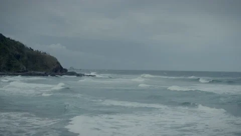 Waves rolling in to the headlands landscape Stock Footage 169316223