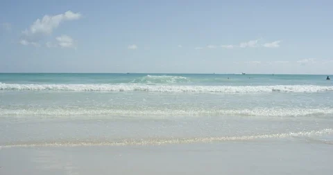 Waves rolling in at low tide Stock Footage 107635277