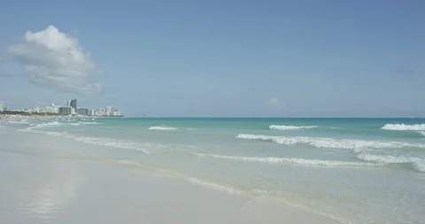Waves rolling in at low tide South Beach Miami Stock Footage 107634425