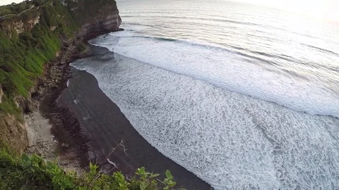 Waves rolling one by one at sunset on the cliff Stock Footage 88111054