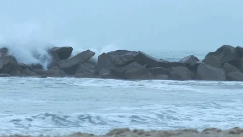 Waves Rolling Over Rocks Closeup Video stock 211779844