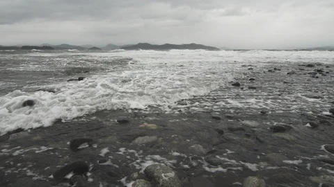 Waves rolling over a rocky beach Stock Footage 122361472