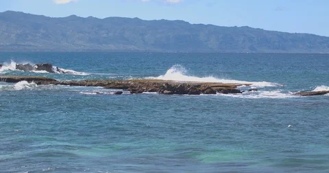 Waves Rolling over Three Tables on the North Shore of Oahu Stock Footage 104259198