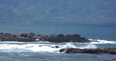 Waves Rolling over Three Tables on the North Shore of Oahu Stock Footage 104373966