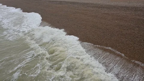 Waves rolling onto a pebble beach in Deal, Kent Stock Footage 268022377