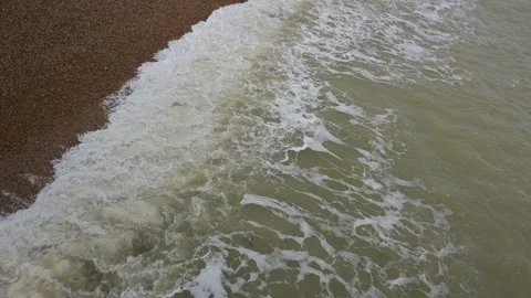 Waves rolling onto a pebble beach in Deal, Kent Stock Footage 268022407