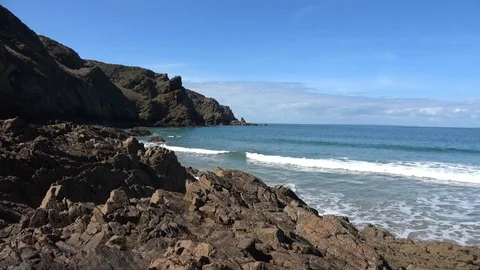 Waves Rolling in to Plemont Beach on Jersey Channel Island Stock Footage 87697877