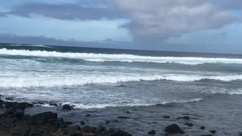 Waves rolling in off of Poipu Beach Stock Footage 144461273