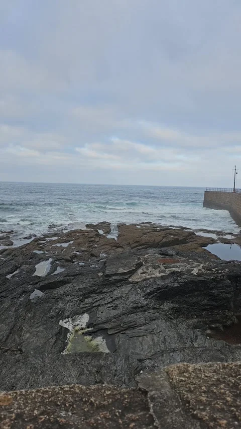 Waves rolling at porthleven pier in cornwall Video stock 244522816