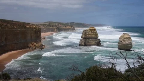 Waves Rolling Into Rock Cliffs at Twelve Apostles Victoria Australia Stock Footage 80627822