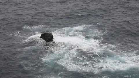 Waves rolling on a rock Stock Footage 106624718
