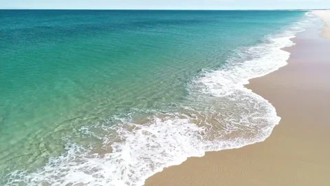 Waves rolling onto sand Stock Footage 165334952
