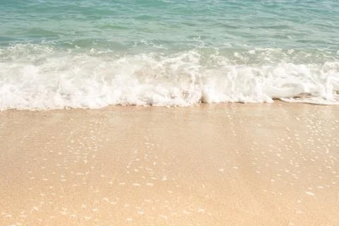 Waves rolling on the sand, space for text Stock Photos