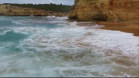 Waves rolling on the sandy beach. Aerial view Vídeos de archivo 81569770