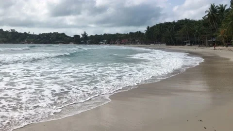 Waves rolling on a sandy beach Stock Footage 146821375