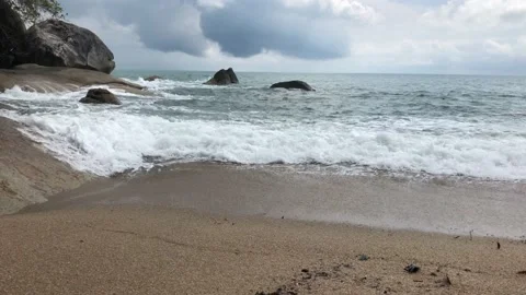 Waves rolling on a sandy beach Stock Footage 146821377