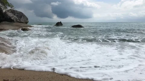 Waves rolling on a sandy beach Stock Footage 146821593