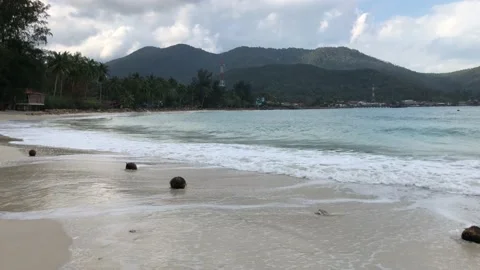 Waves rolling on a sandy beach Stock Footage 146821666