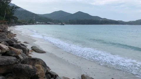 Waves rolling on a sandy beach Stock Footage 146821702