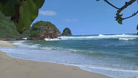 Waves rolling up sandy beach in Malang Indonesia Stock Footage 152671217
