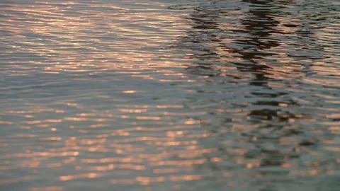 Waves rolling in at sunrise or sunset Stock Footage 261351043