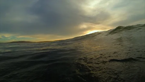 Waves rolling in at sunset. Stock Footage 88368894