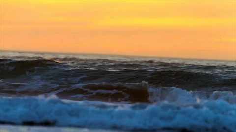 Waves rolling in at sunset. Stock Footage 88406183