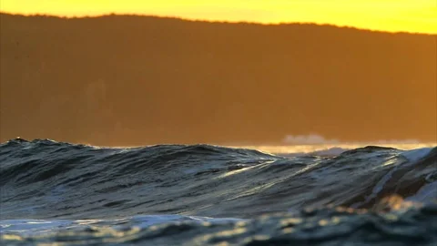 Waves rolling in at sunset. Stock Footage 88406202