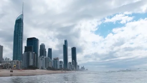 Waves Rolling into Surfers Paradise Beach with Skyline in Background, Gold Coast Stock Footage 246138764