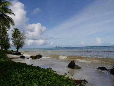 Waves rolling in toward the soft white sands of Micro Beach, Saipan, Northe.. Stock Photos