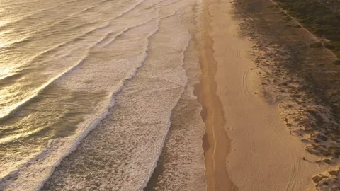 Waves rolling towards white sand beach Stock Footage 201523067