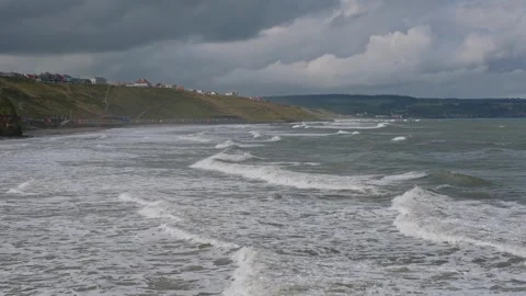 Waves rolling in to Whitby beach, North Yorkshire (slow motion) Stock Footage 287752180