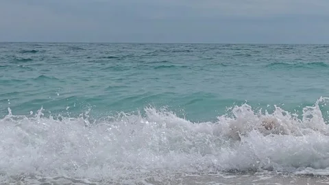 The waves of the rough sea in the beach of Sassi Neri Stock Footage 283740755