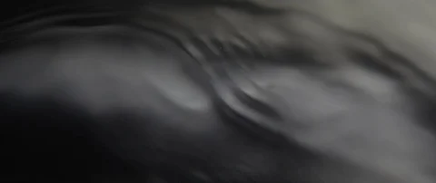 The waves run over the dark texture of the underlying water in slow motion Stock Footage 106002903