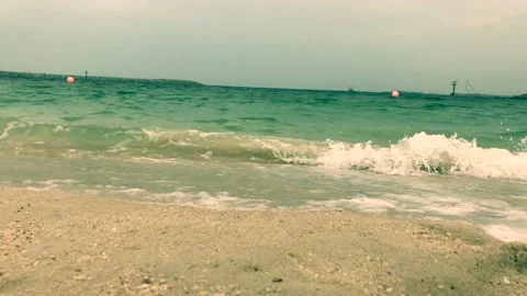 Waves that run on the sandy shore Stock Footage 106300494