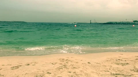 Waves that run on the sandy shore Stock Footage 106300516