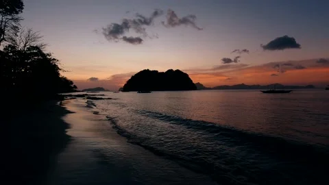 Waves run on the sandy shore of the sea. Sunlight reflect on water surface Stock Footage 134038880