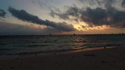 Waves run on the sandy shore of the sea. Sunlight reflect on water surface Stock Footage 234313802