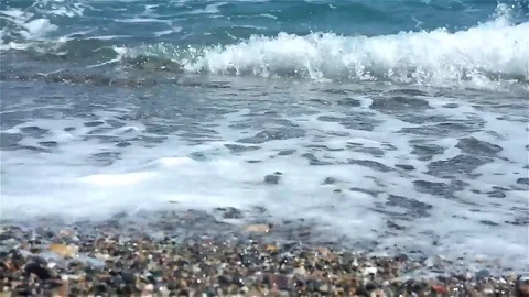 Waves rush onto the beach Stock Footage 83503548