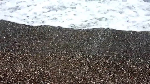 Waves rush onto the beach Stock Footage 83503553