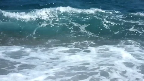 Waves rush onto the beach Stock Footage 83503554