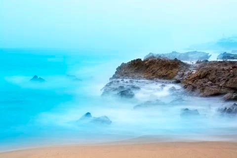 Waves rushing over reef Stock Photos