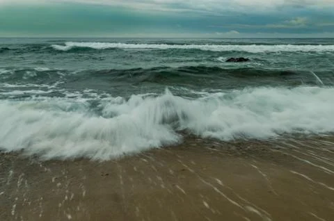 Waves rushing to shore Stock Photos